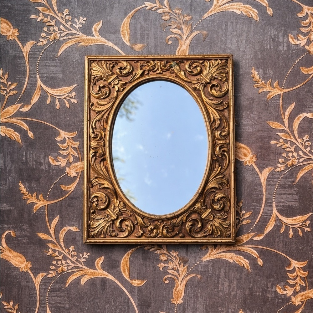 Gold Ornate Mirror with Intricate Scrollwork